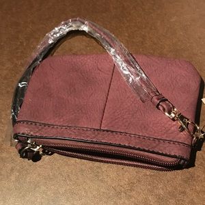 New purple leather clutch